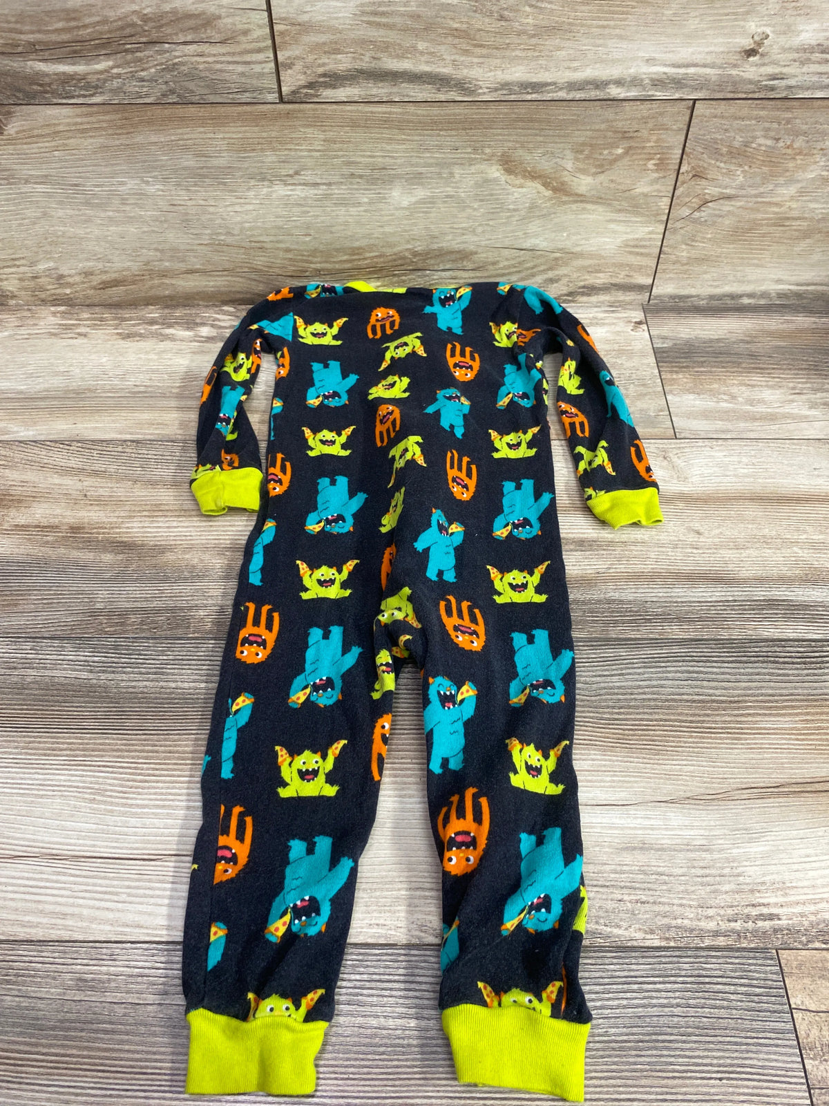 Simple Joys black sleeper for 24m with monster pattern and neon yellow cuffs