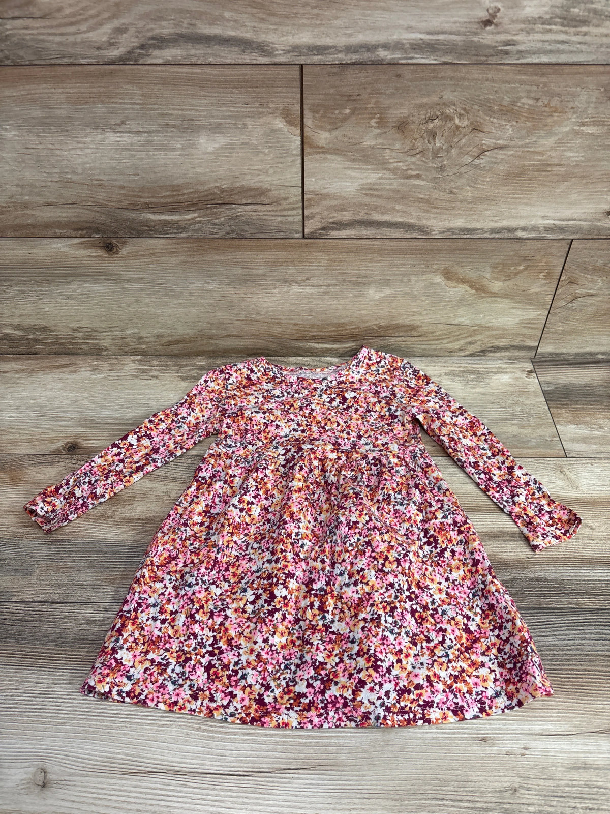Old Navy red and pink floral long sleeve dress for toddlers size 2T on a wood floor