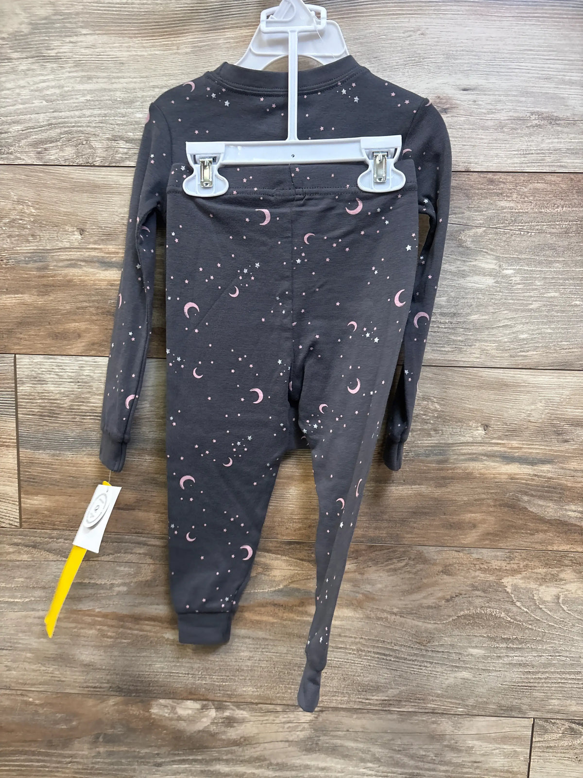 Grey Petit Lem 2pc moon print pajama set for babies, size 24m, on a white hanger
