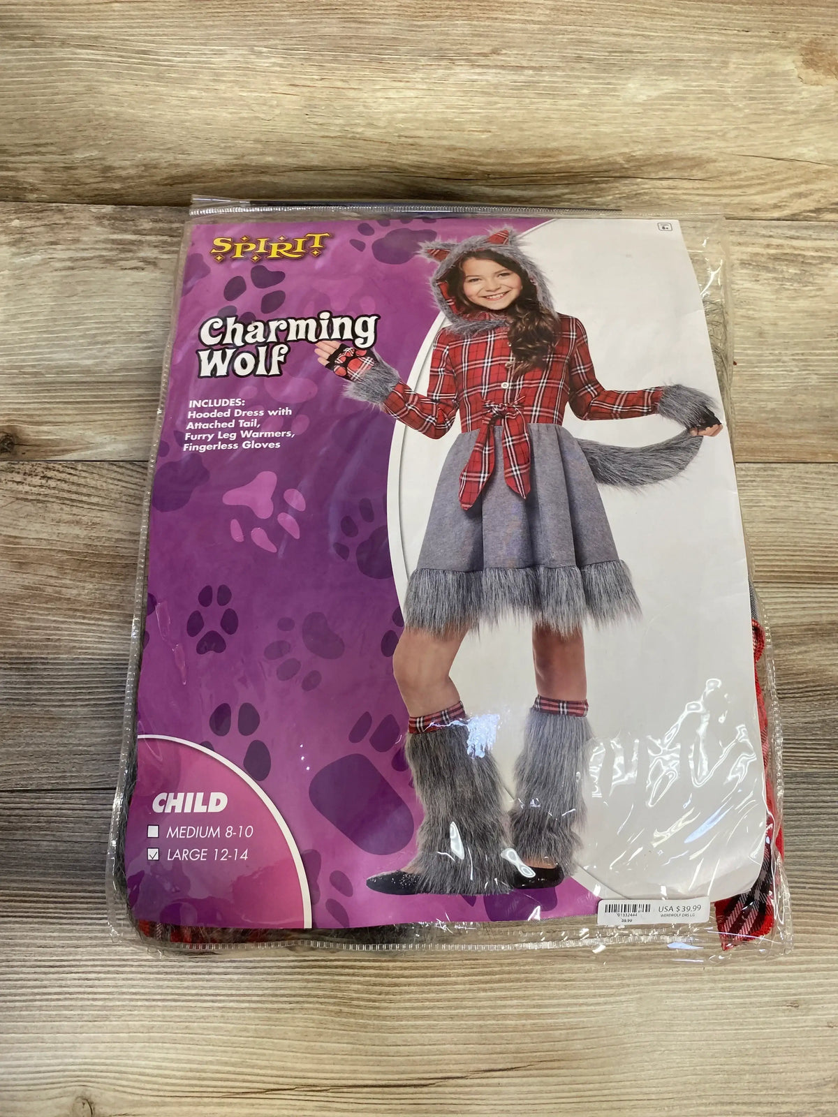 Front view of Spirit Charming Wolf costume package with red plaid dress, attached tail, furry leg warmers, gloves, and size 12-14