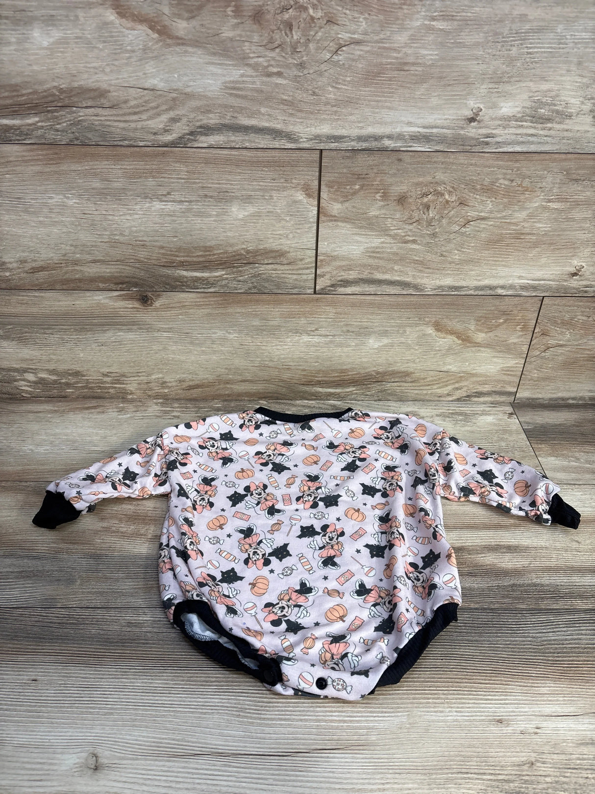 Minnie Mouse baby onesie with pumpkins, candy, and black cats on light background, perfect for Halloween or fall outfits.