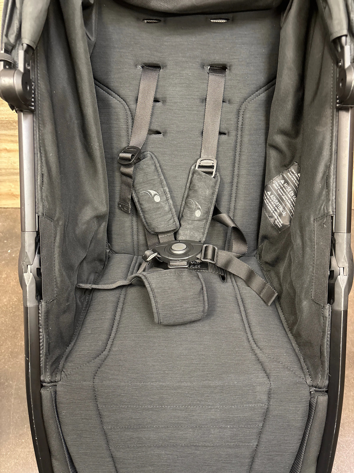 Close-up of Baby Jogger City Mini GT2 All Terrain Stroller in Opulent Black showcasing five-point harness and padded seat
