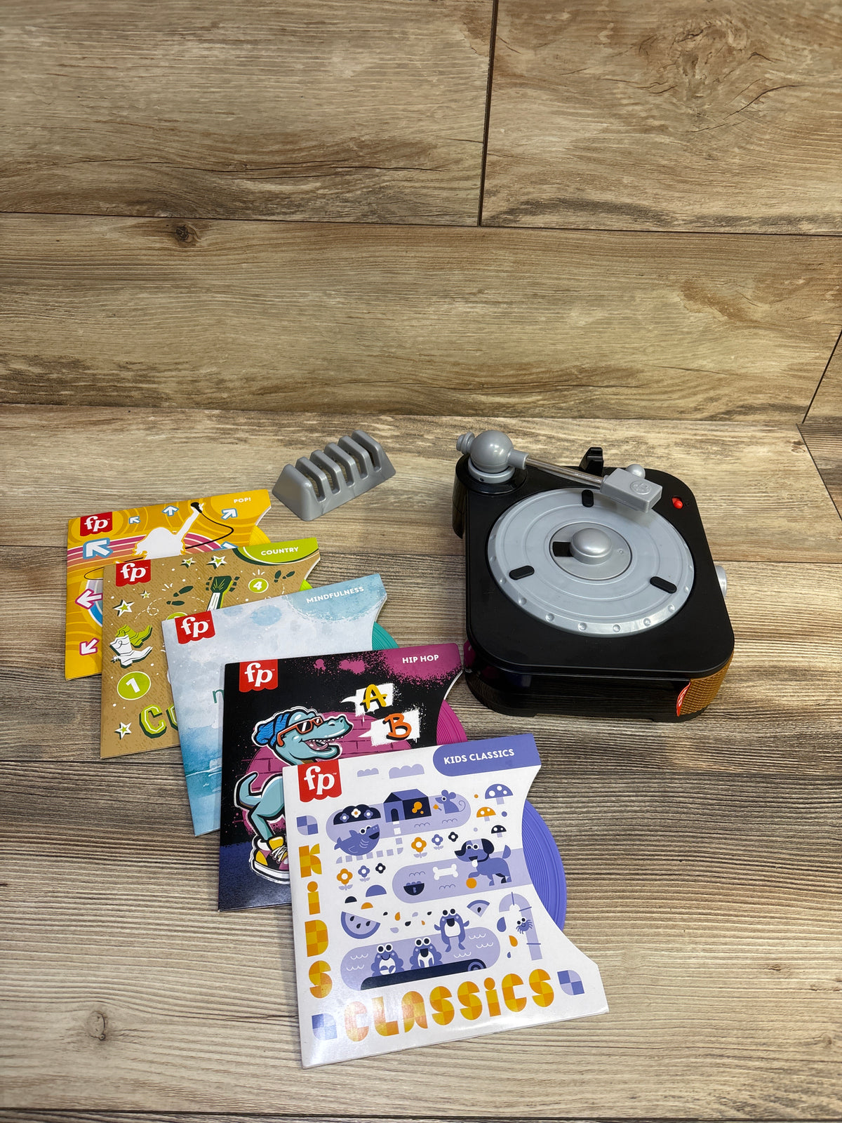 Fisher-Price Rockin' Record Player Musical Toy with 5 Records