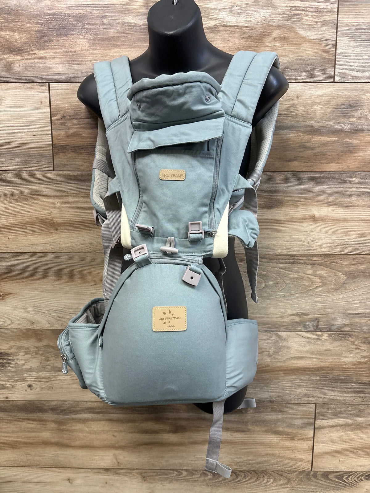 Me n Mommy To Be FRUITEAM 6-in-1 Baby Carrier with Hip Seat in blue on a mannequin