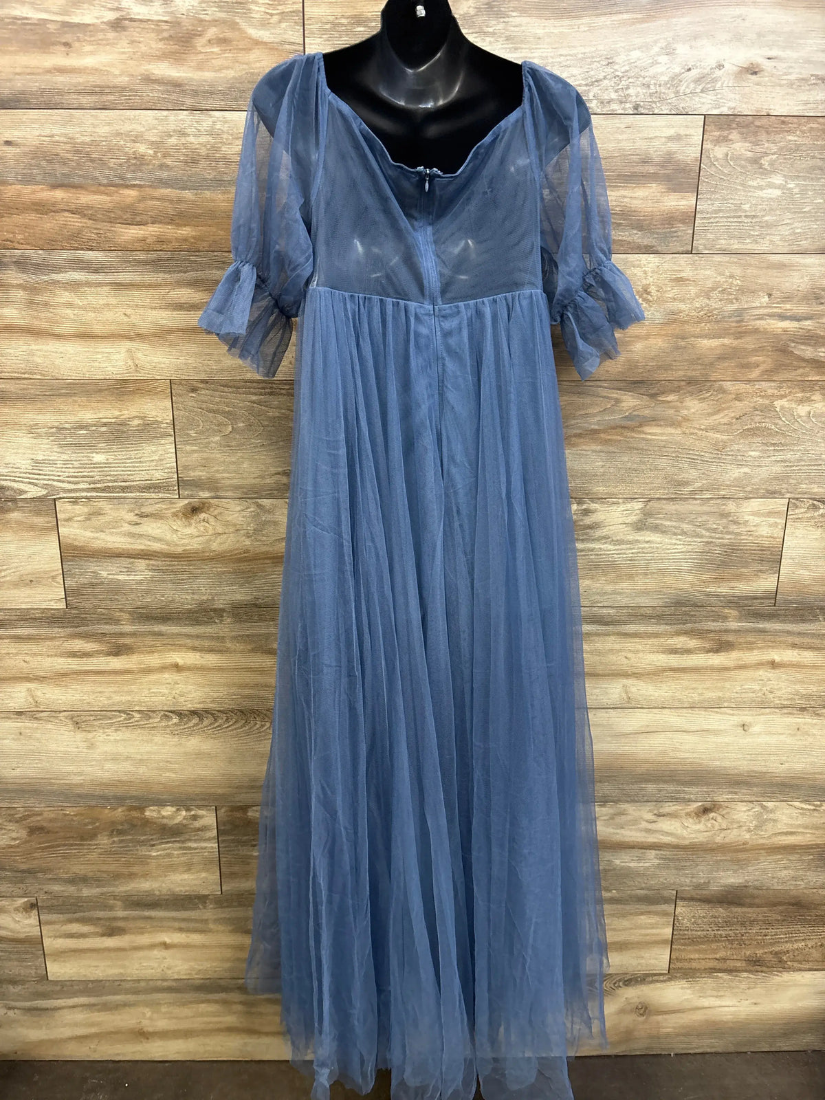 Front view of Ever Pretty maternity off shoulder blue tulle maxi dress with puff sleeves against wood wall