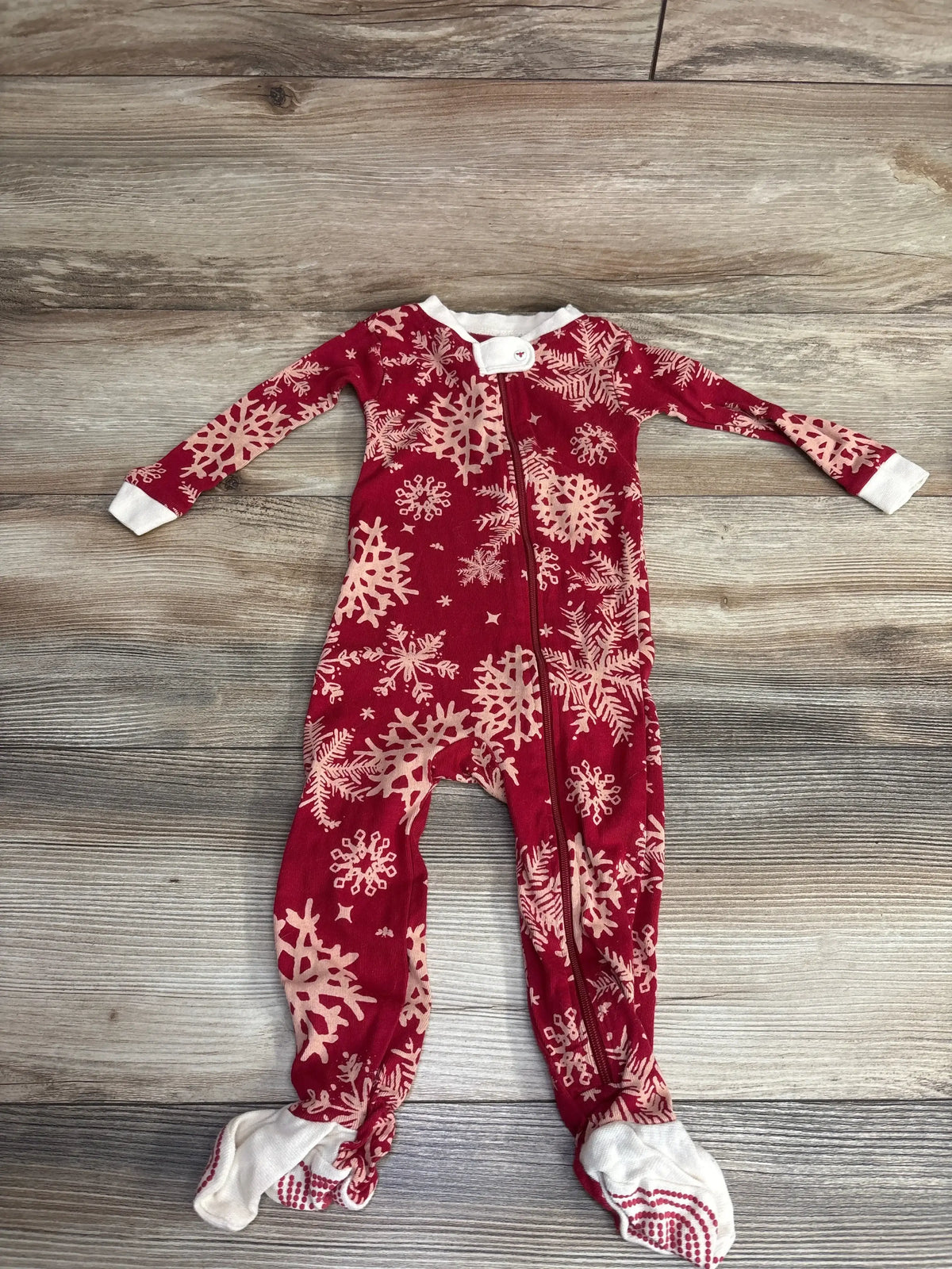 Red baby snowflake footed pajamas with white cuffs, holiday sleepwear for infants