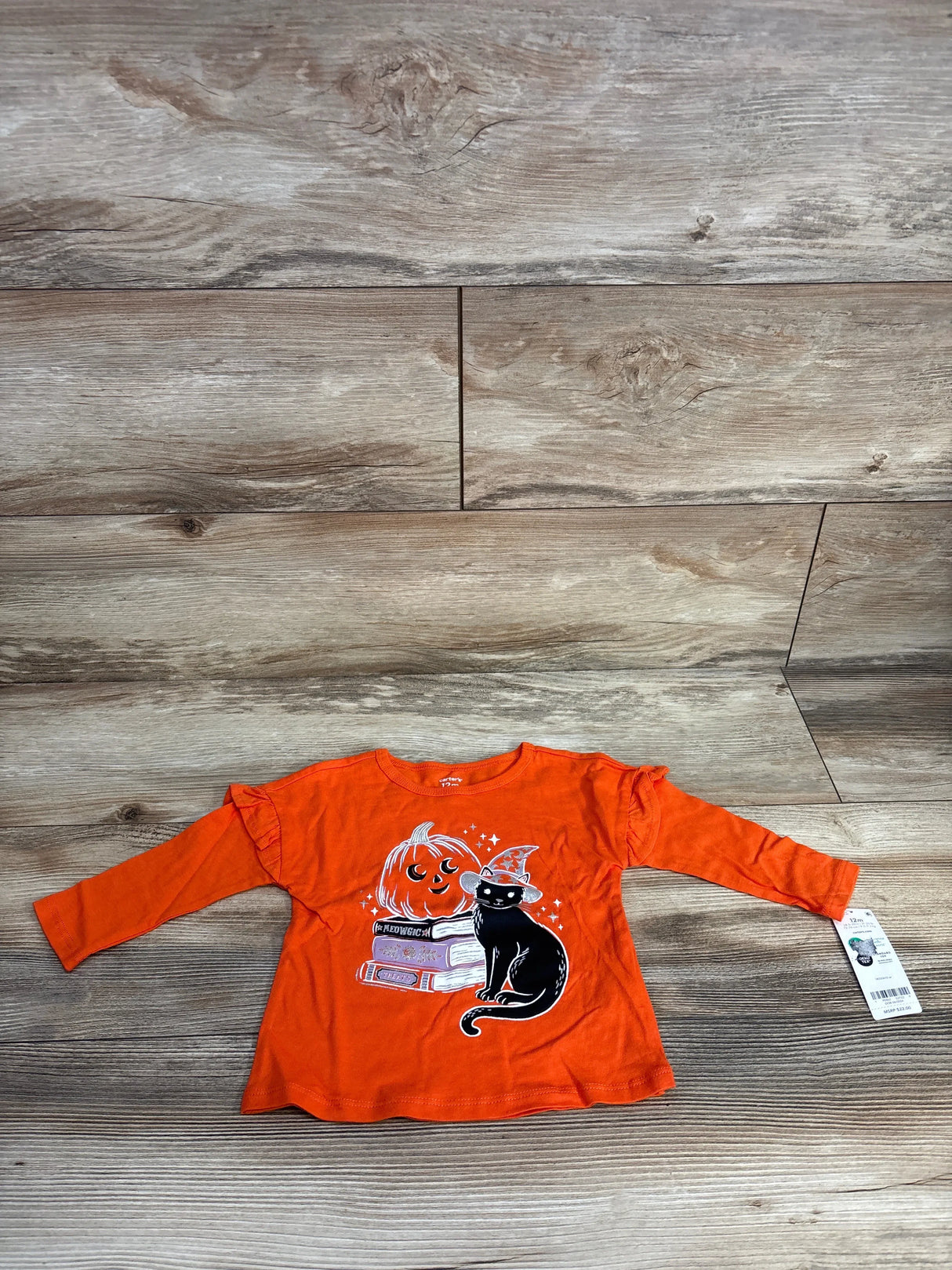 Orange Halloween baby shirt with black cat, pumpkin, and books graphic, size 12m