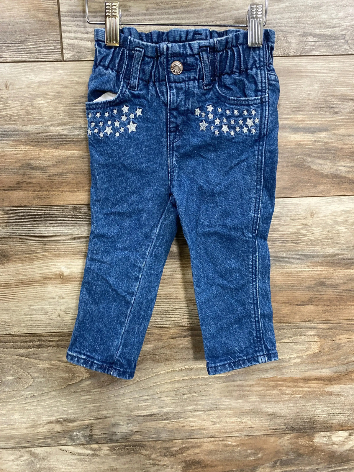 Toddler blue denim jeans with elastic waistband and silver star embellishments on front pockets