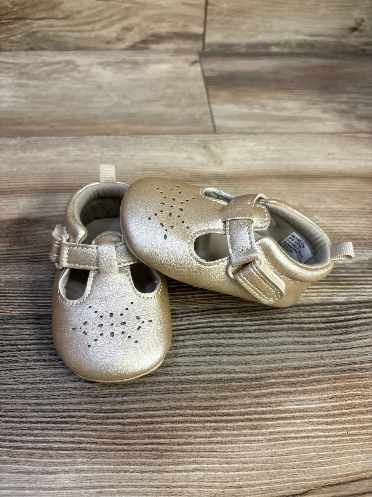 Angled view of Just One You Stella closed toe sandals in gold showcasing perforations and hook-and-loop straps