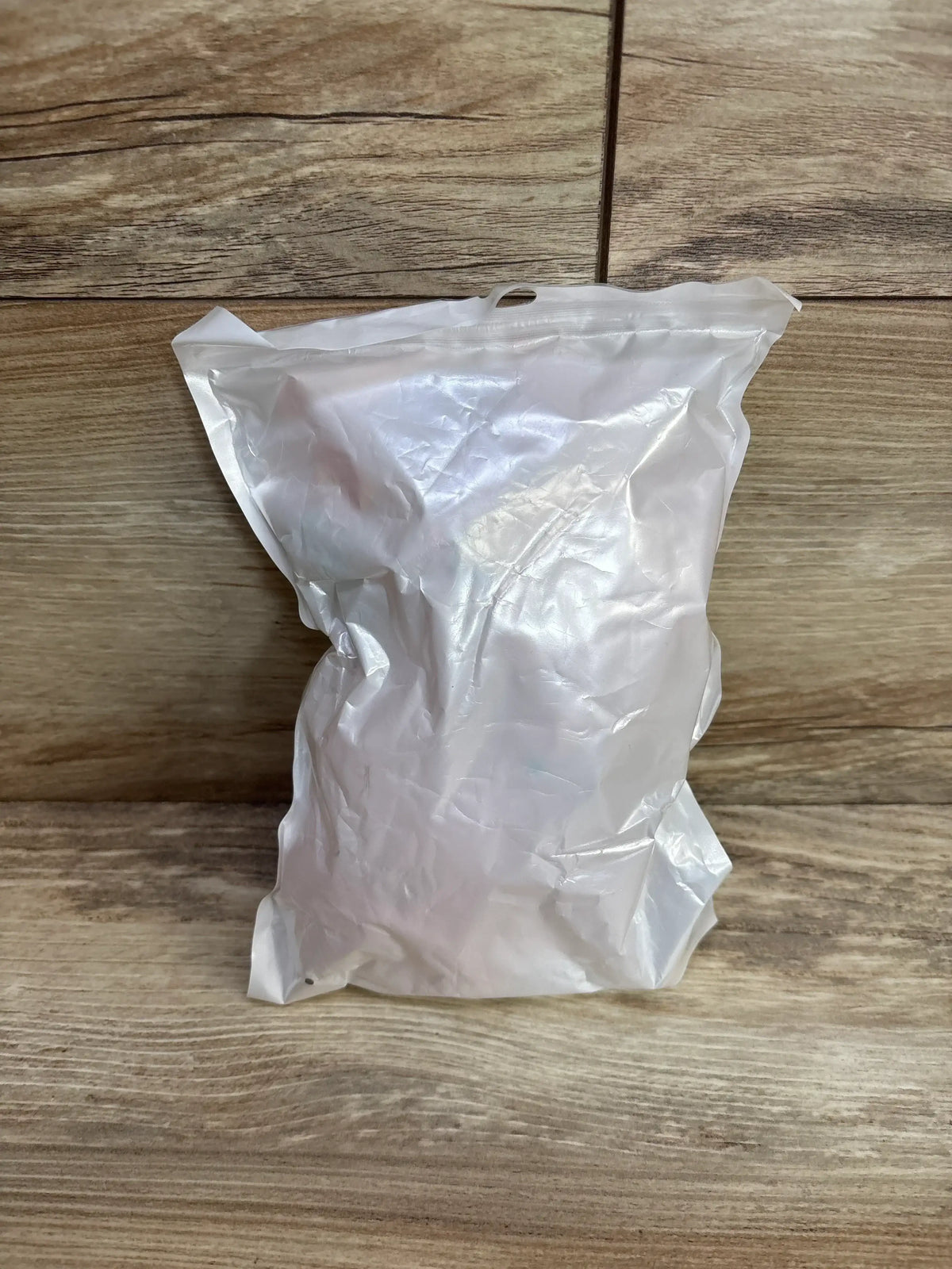 Front view of the NEW Bbsky Bunny Security Blanket Pink in sealed packaging on a wooden surface