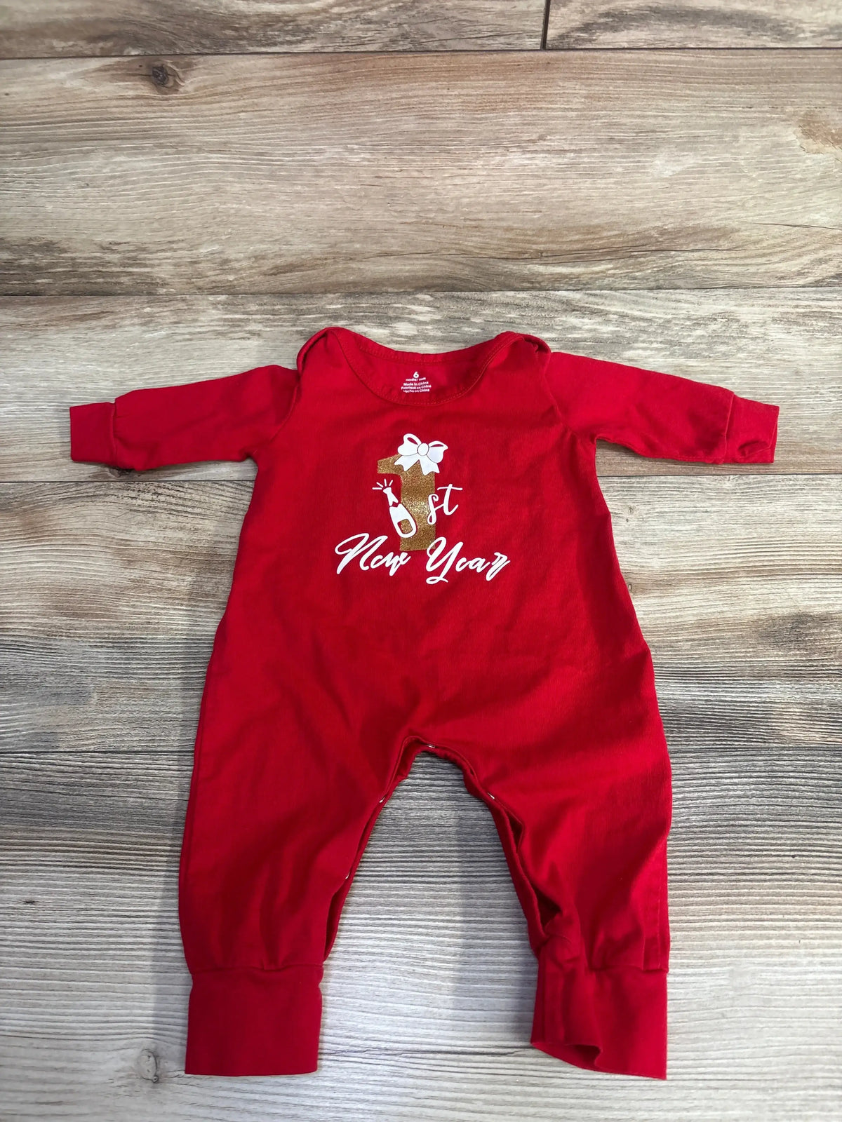 Red baby onesie with '1st New Year' gold print, perfect for infant holiday outfits and newborn celebrations.