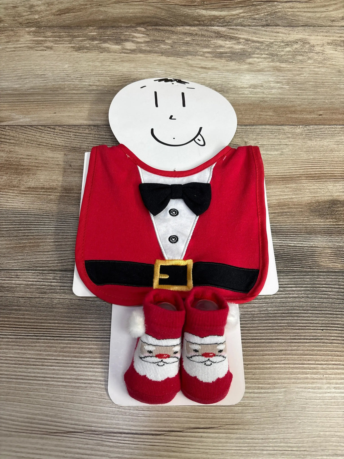 Santa-themed baby bib and socks set for festive holiday wear