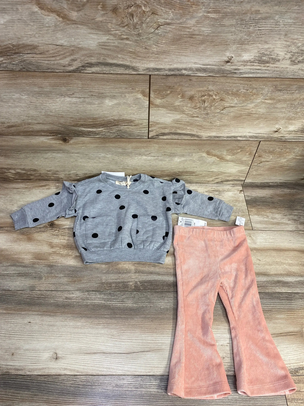 Kids outfit with gray polka dot ruffle sleeve sweater and pink corduroy bell-bottom pants