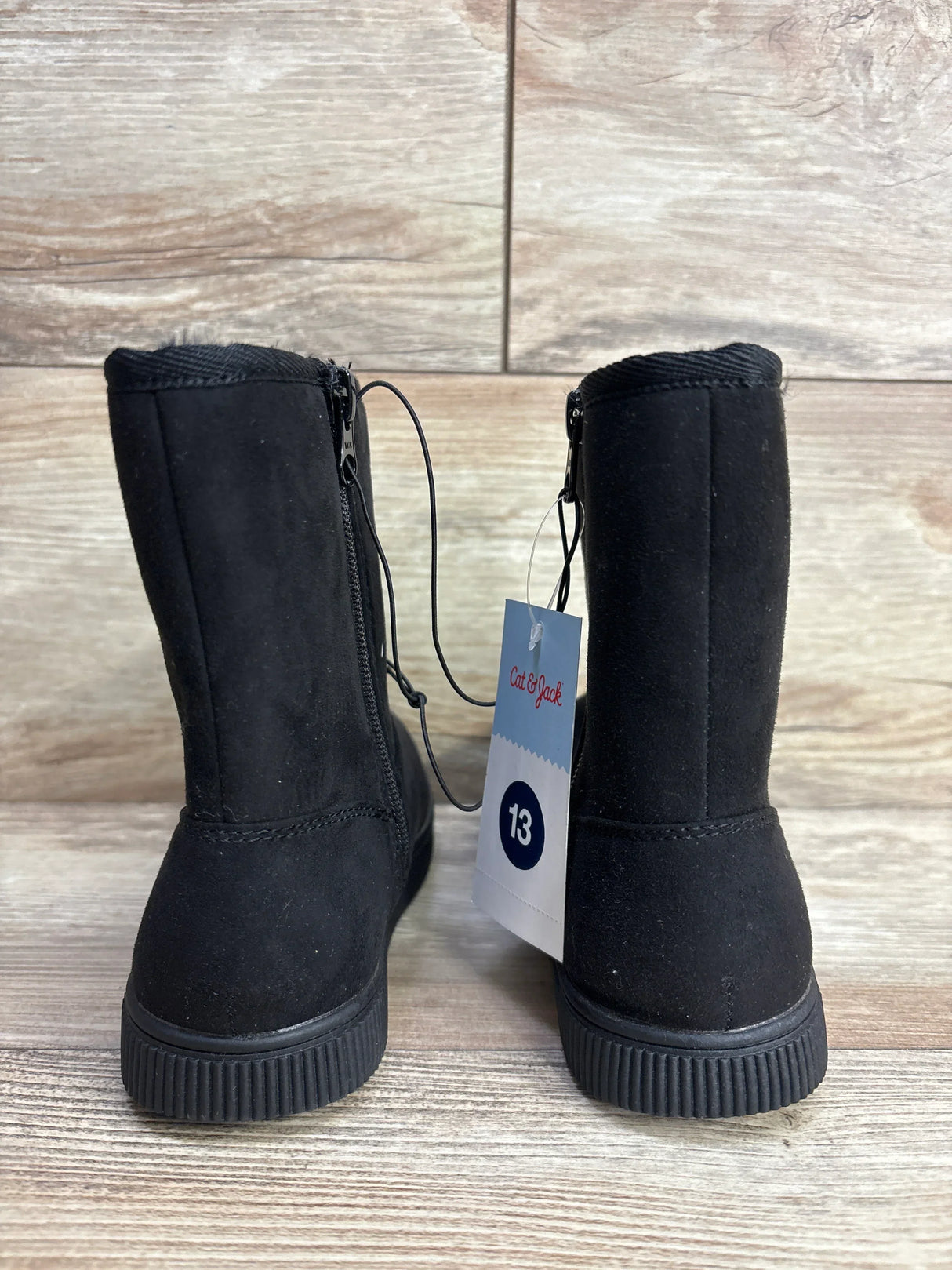 Black Cat & Jack kids boots size 13 with zip, new with tag, on wood background