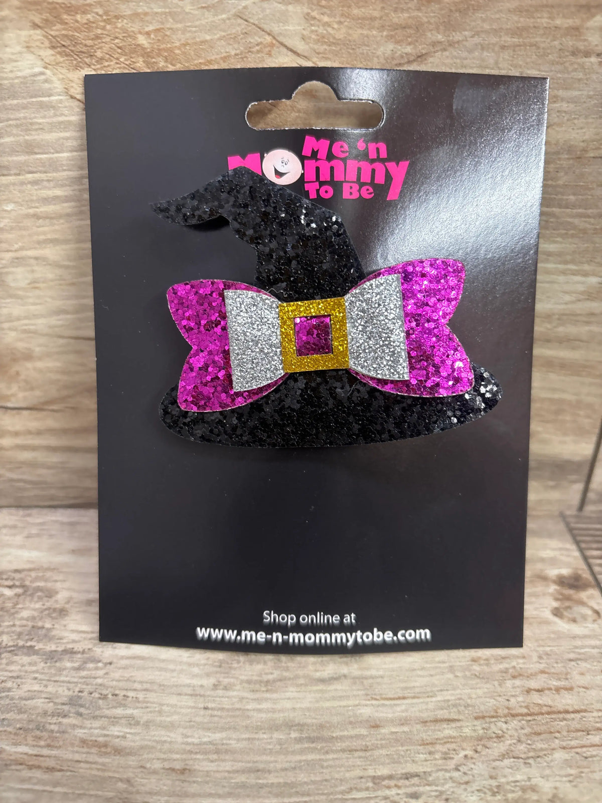 Front view of NEW Witch Hat Glitter Hair Bow showcasing a pink and silver glitter bow on a black witch hat display