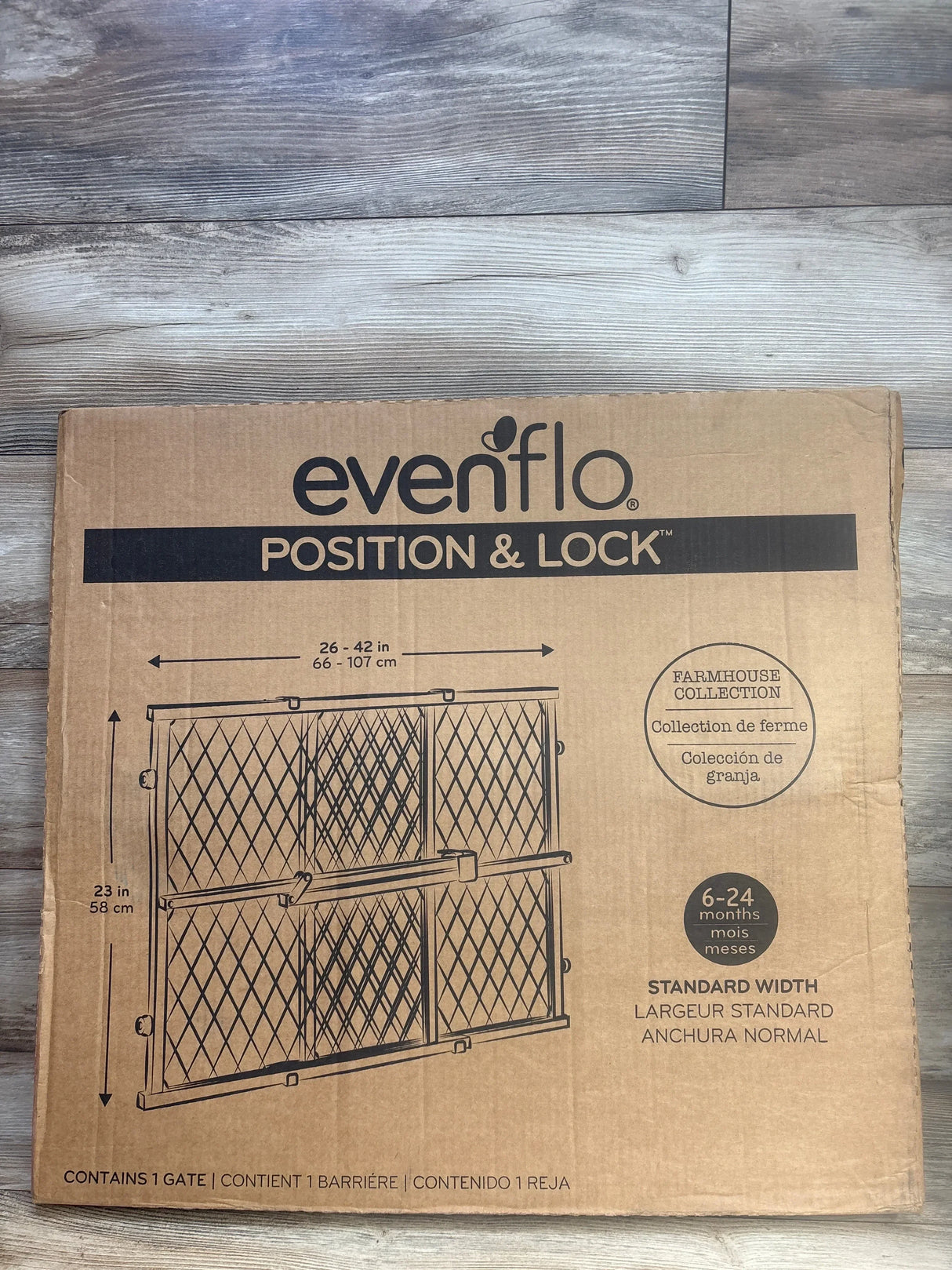 Front view of Evenflo Position & Lock gate box showing Farmhouse Collection and diagram with adjustable width 26-42 in