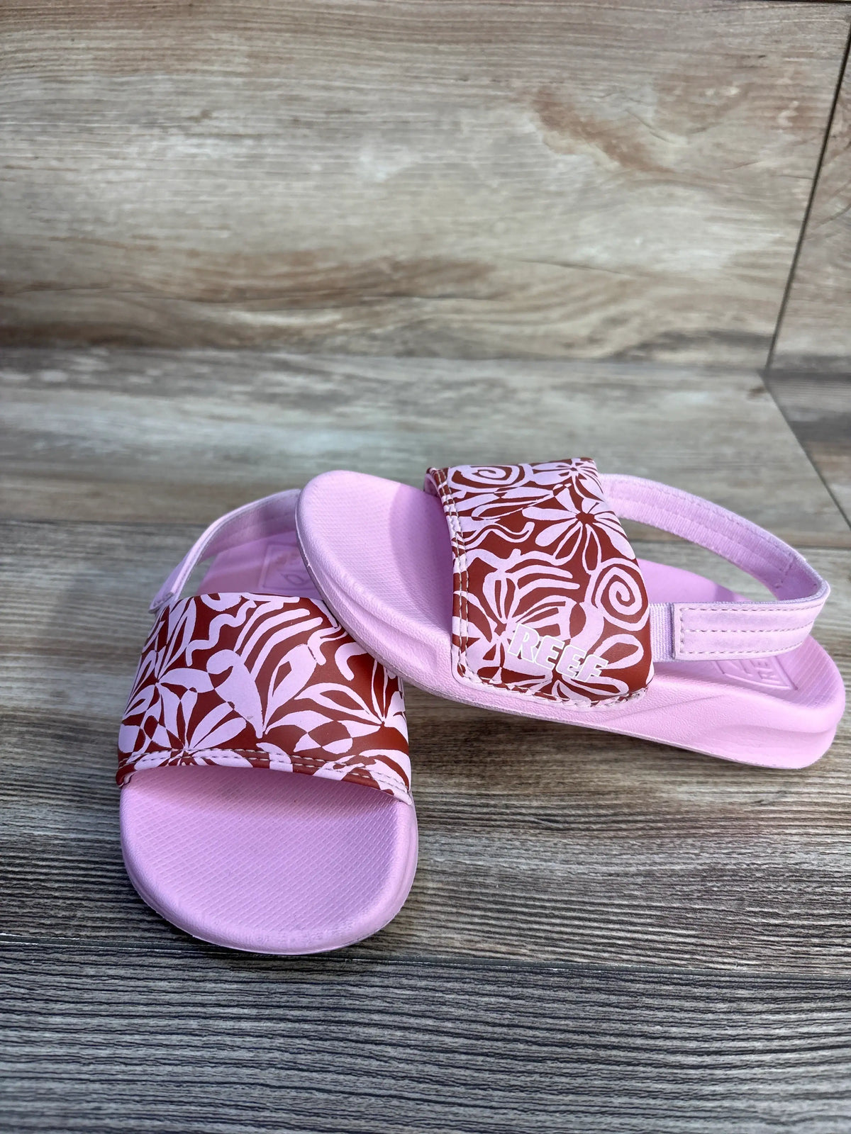 Reef Modern Floral Sandals in pink with brown and white floral print, size 9c
