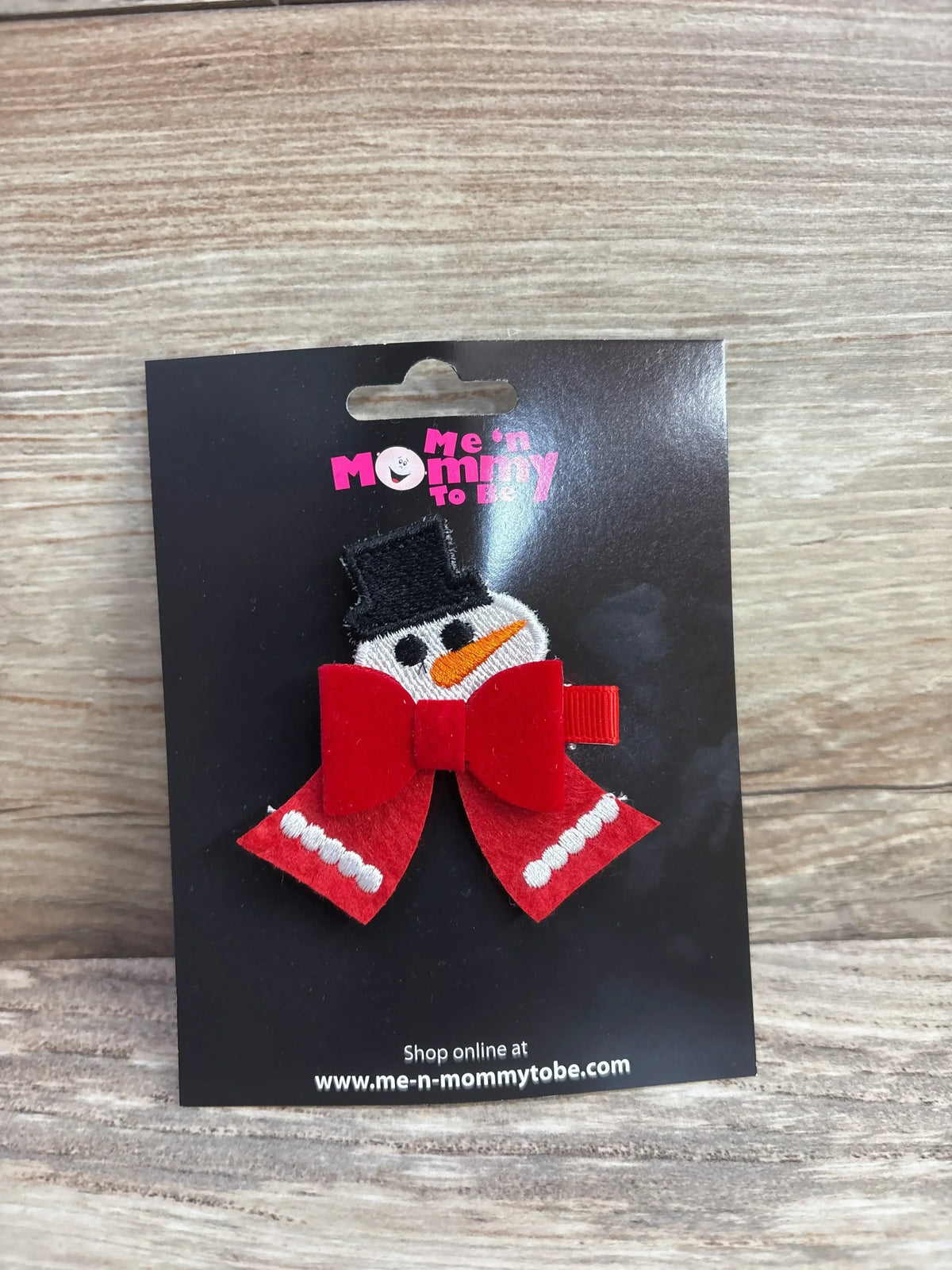 Snowman hair bow with red scarf and black hat, festive kids accessory for winter holidays