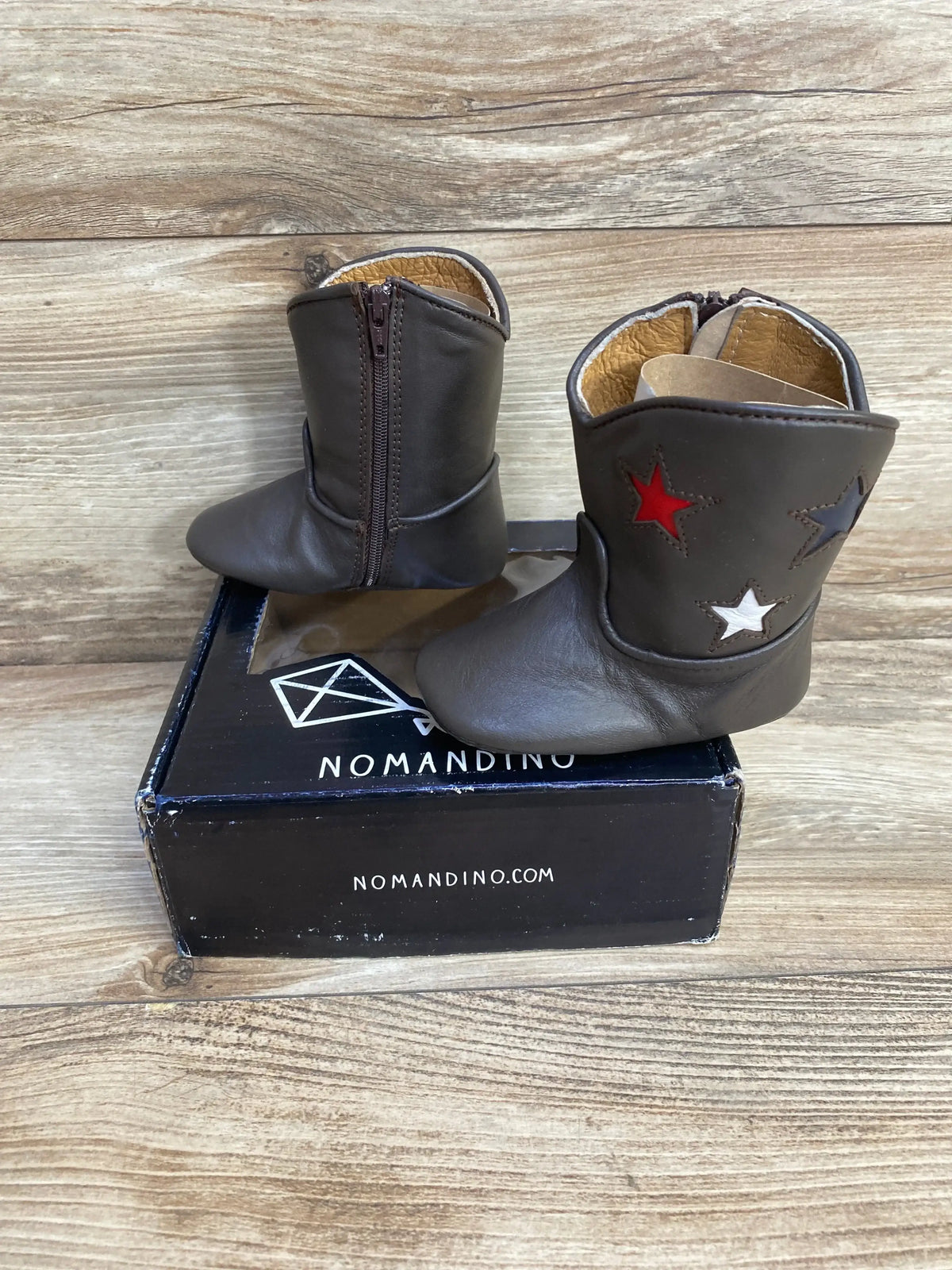 Front view of Nomandino Spark chocolate boots, size 2 (6-9 months), glitter upper and faux-fur cuff on white background