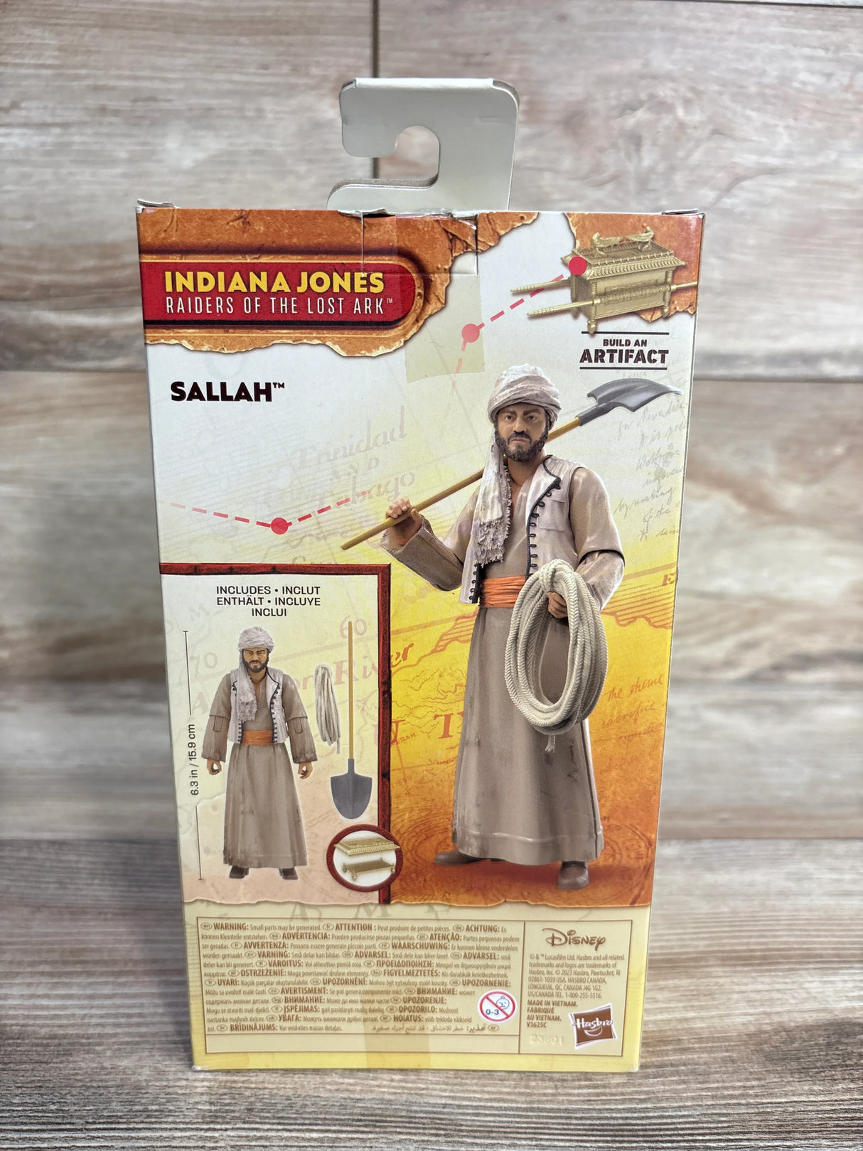 Indiana Jones Raiders of the Lost Ark Sallah action figure packaging on wood background