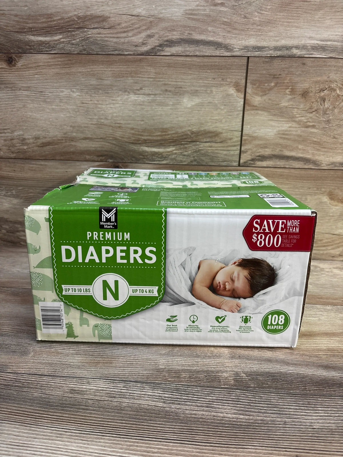 Front view of Member’s Mark Premium Diapers package showcasing newborn size N, 108 diapers, and up to 10 pounds on wood