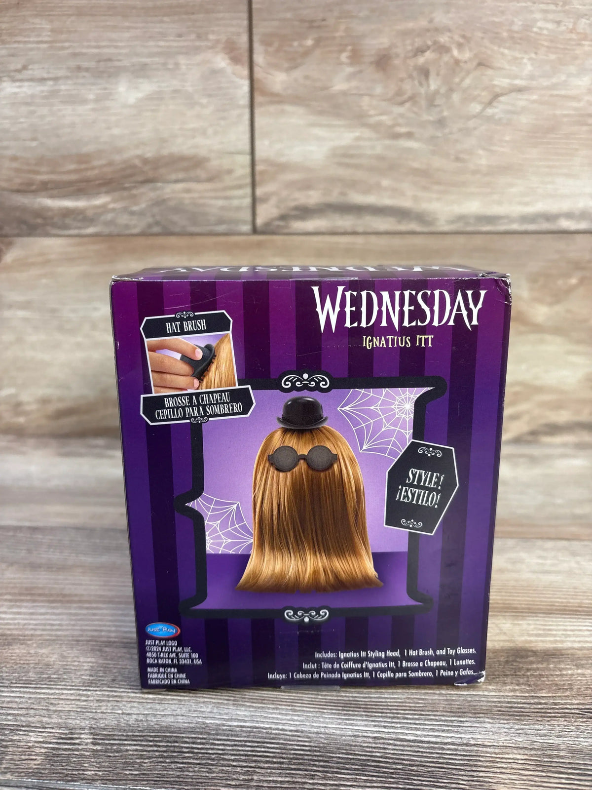 Boxed Wednesday Ignatius Itt 10in styling head showing purple box with brown hair, black bowler hat and glasses on table