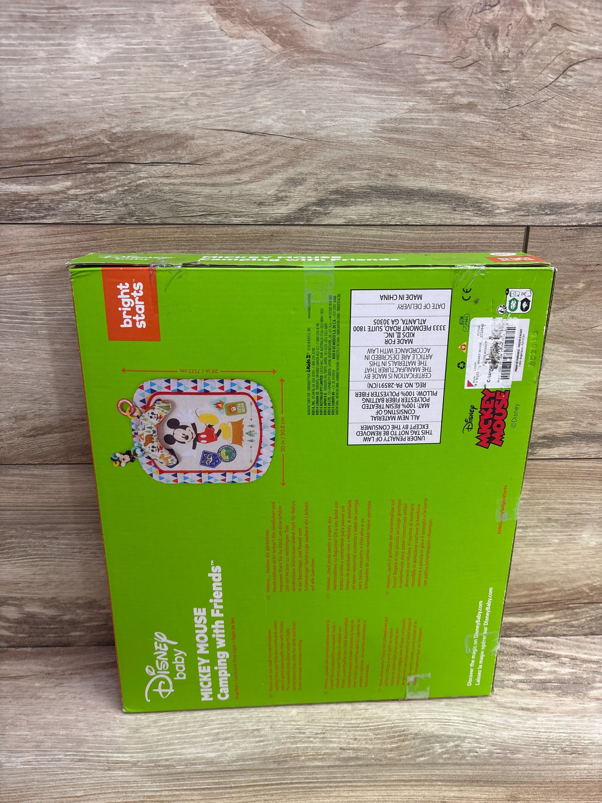 Disney Baby Mickey Mouse Camping With Friends playmat in green box on wood floor