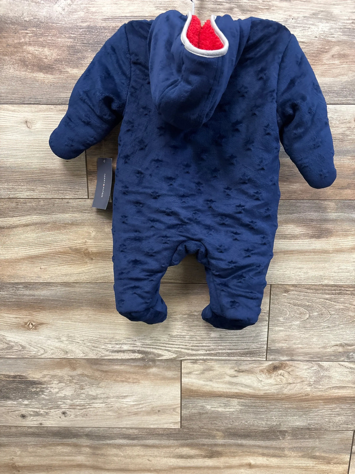 New Me n Mommy To Be blue hooded fleece baby bunting suit on a wooden background