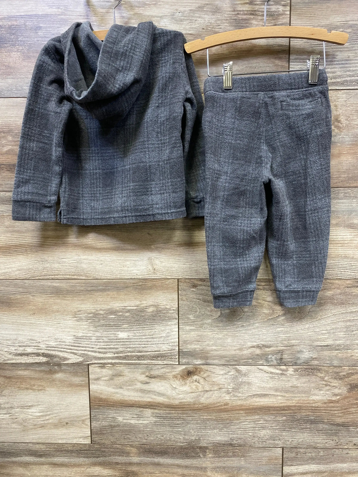 Gray plaid toddler hoodie and pants set on wooden background, kids clothing outfit