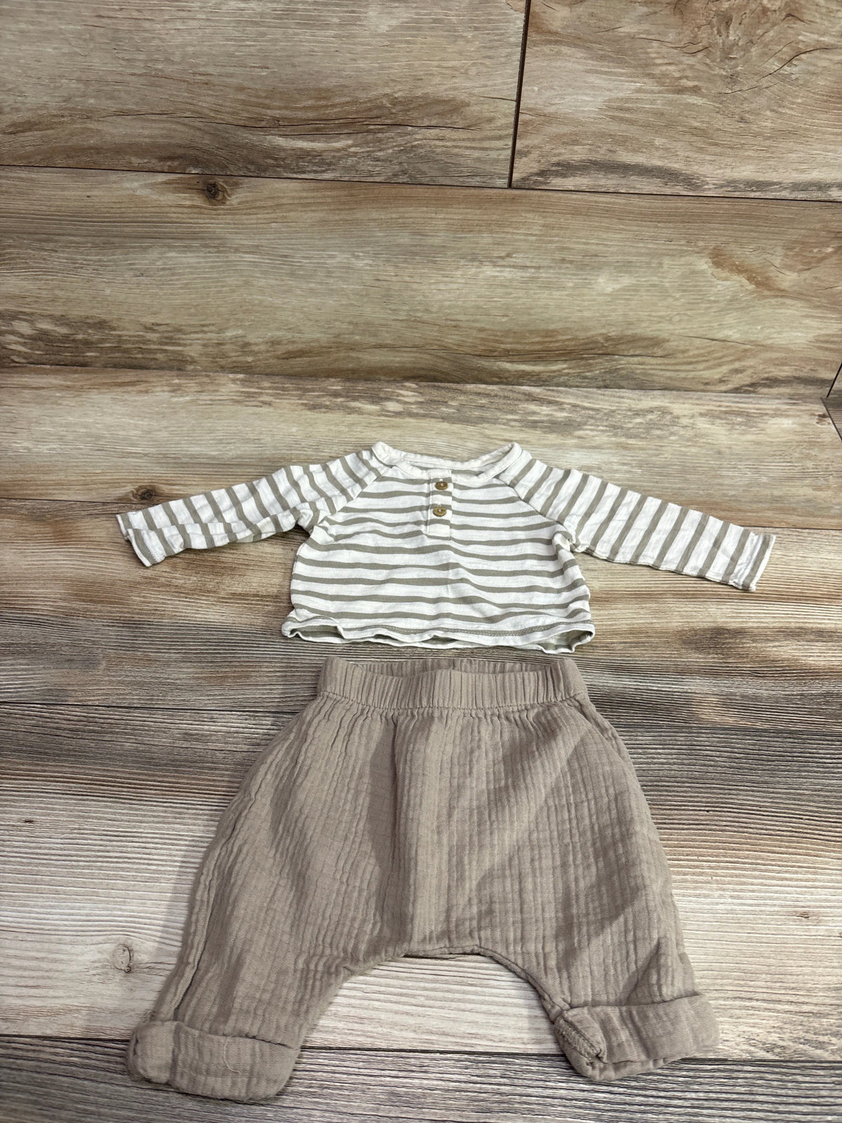 Top-down view of Cloud Island 2pc Long Sleeve Henley Shirt & Pants Set in tan with striped henley, button placket, and cuffed pants