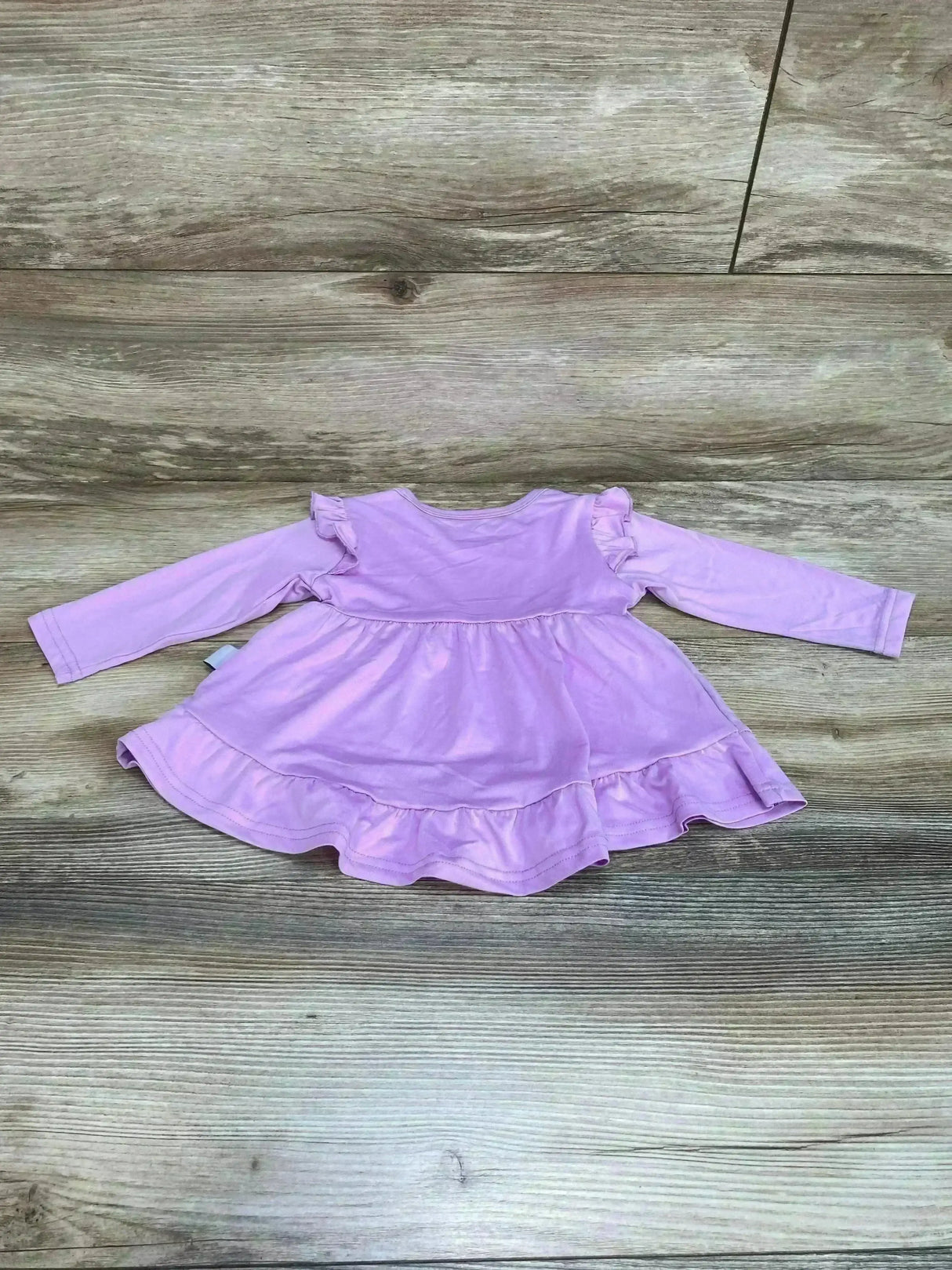 Front view of purple Synpos tiered ruffle baby dress (6-12m) showing layered ruffles and gathered waist on white background