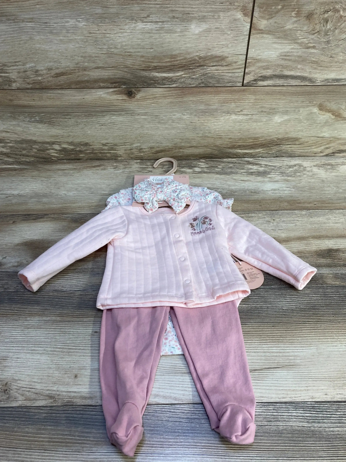 Front view of 4-piece pink floral baby set size 6-9m with quilted snap jacket, floral bodysuit, footed pants and bow headband