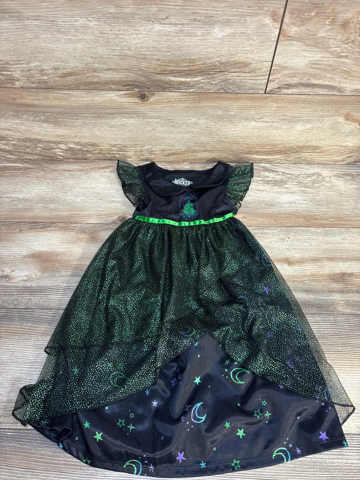 Kids black costume dress with sparkly green mesh, moon and star pattern, short sleeves
