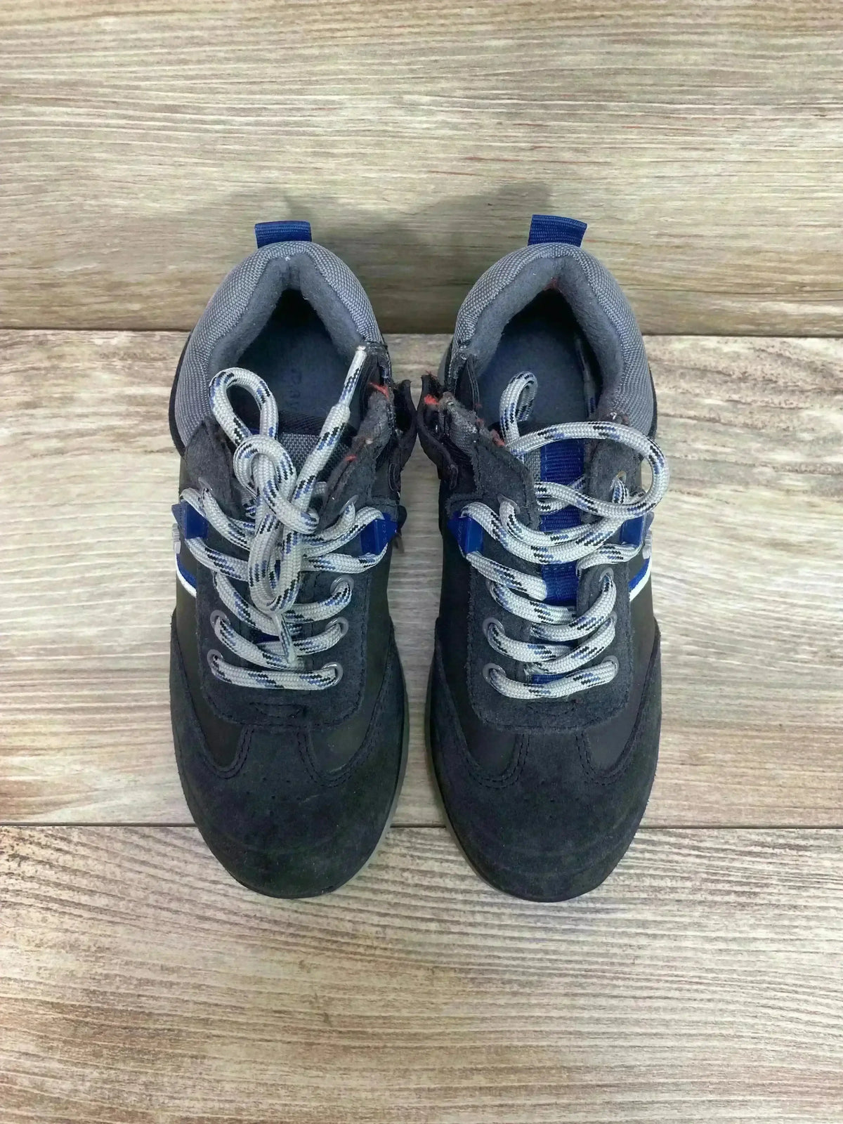 Top-down view of toddler gray Mayoral Colorblock City sneakers with blue accents and gray patterned laces on light wood floor