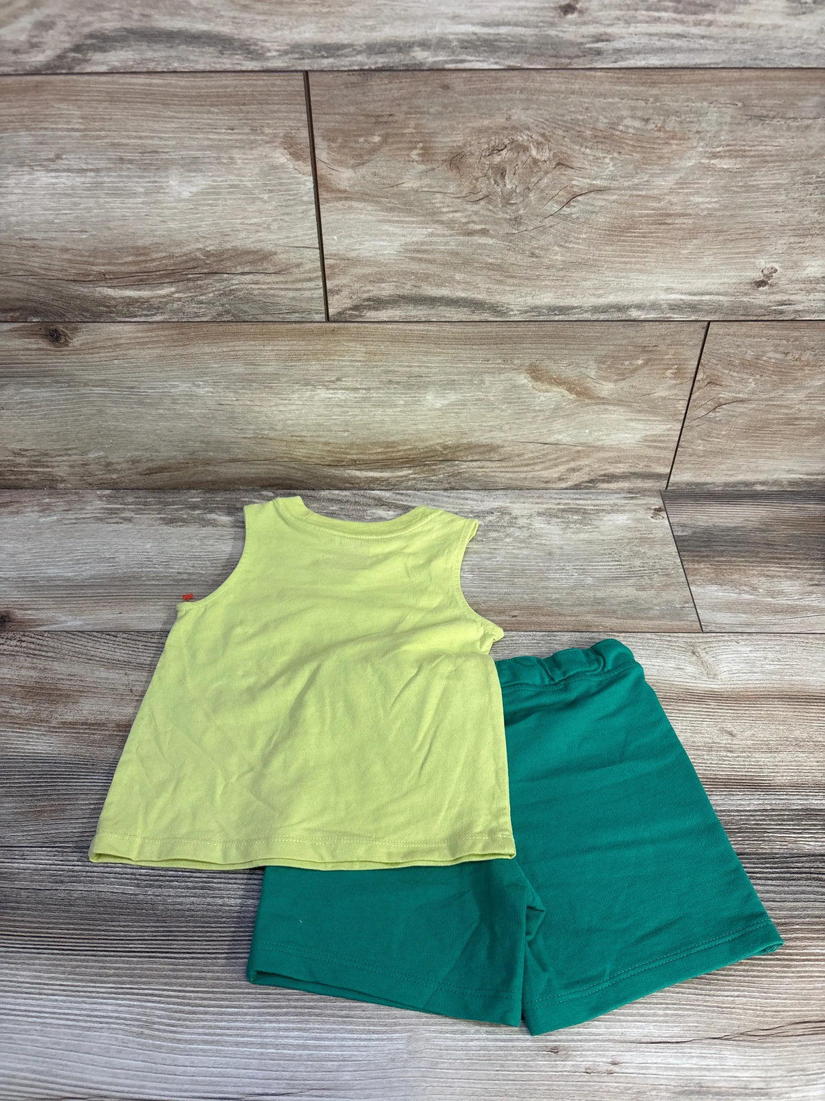 Flat lay of Cat & Jack 18-month tank top and shorts set showcasing lime green tank top and teal drawstring shorts