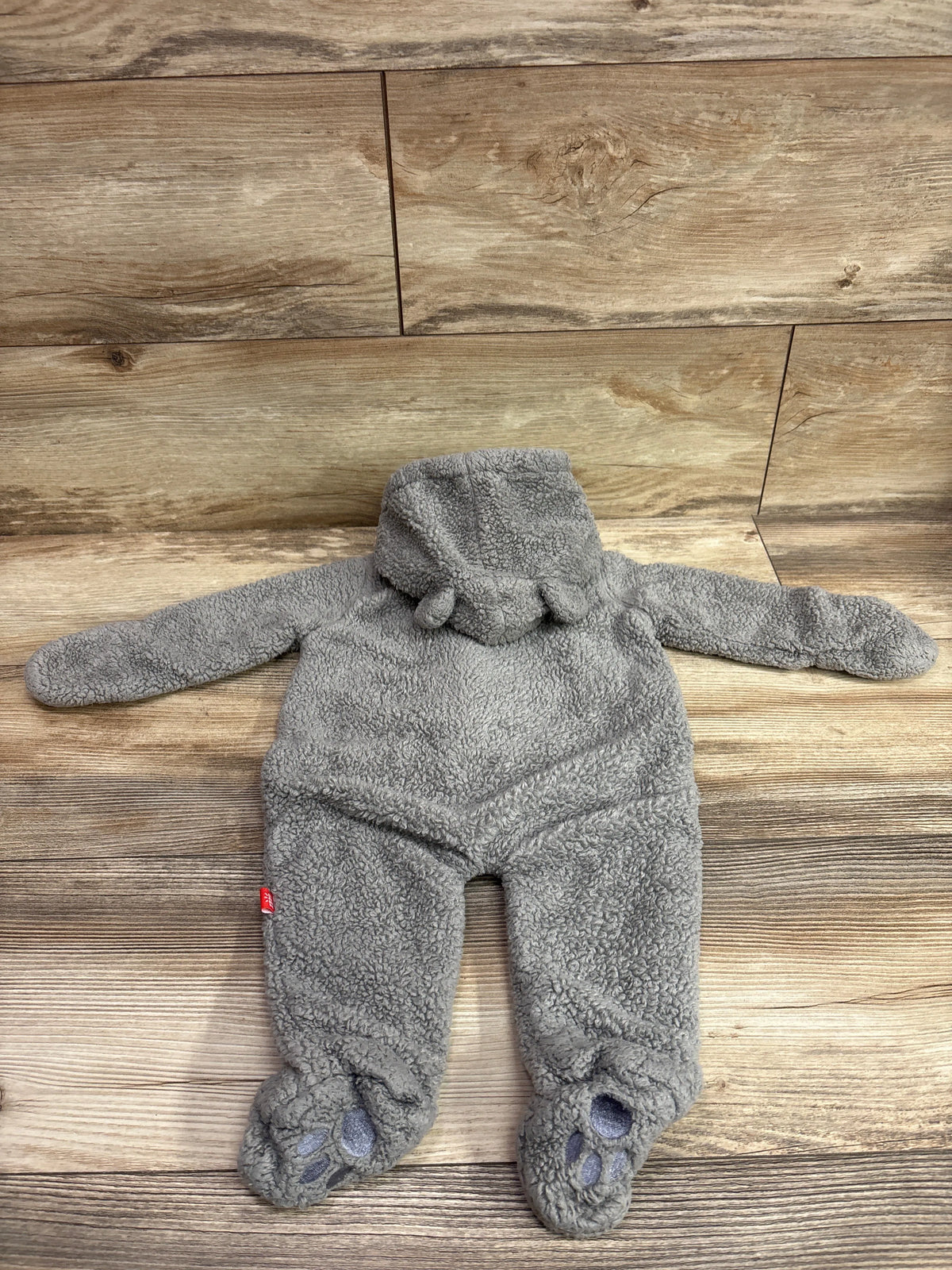 Grey Magnetic Me Sherpa magnetic pram baby sleeper for 0-3 months on a wood background