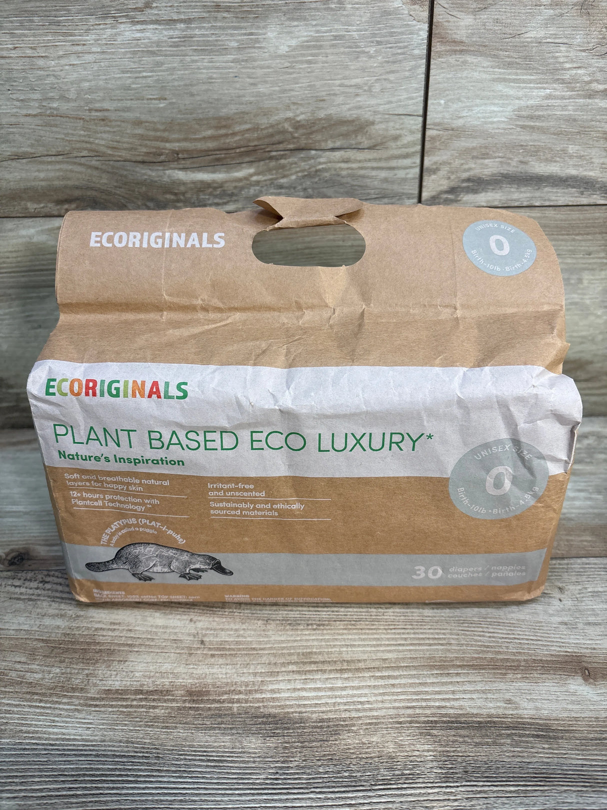 Ecoriginals plant based eco luxury unisex size 0 diapers pack on wood background