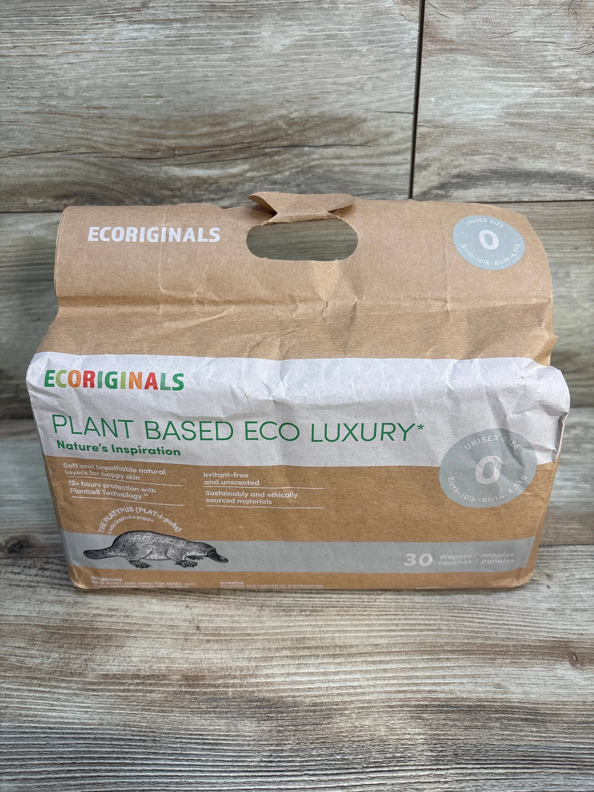 Ecoriginals plant based eco luxury unisex size 0 diapers pack on wood background