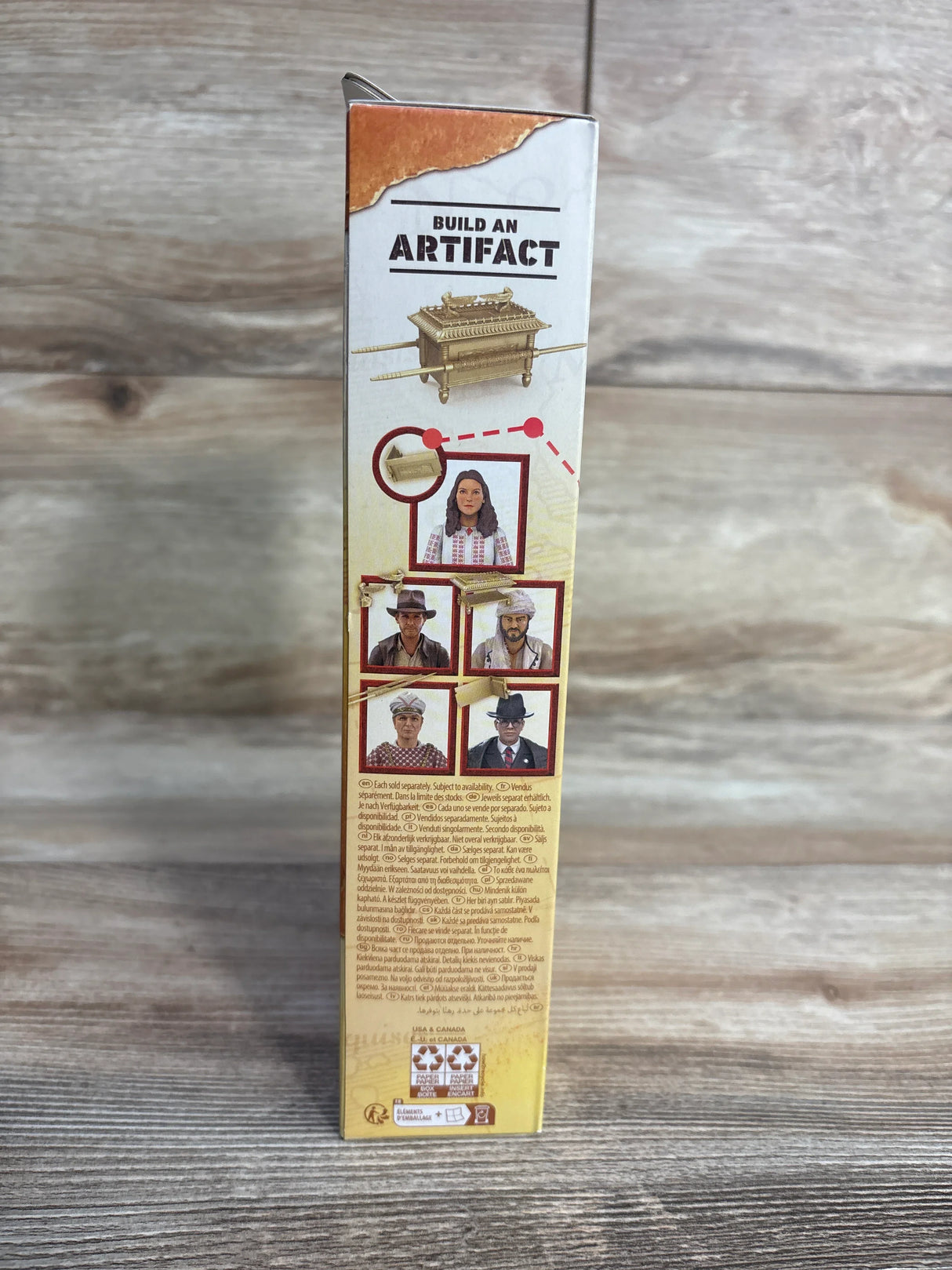 Build an Artifact toy box side with character photos and Ark of the Covenant illustration