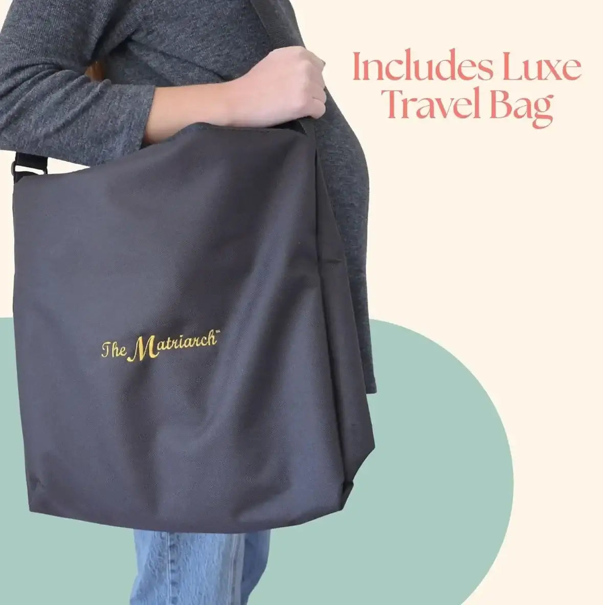 Pregnant woman holding included black Matriarch travel bag, overlay text Includes Luxe Travel Bag