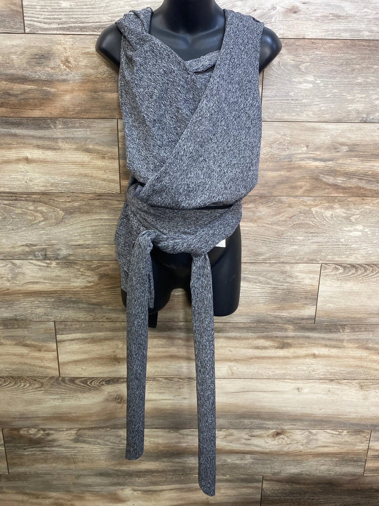 Front view of Boppy ComfyFit hybrid carrier in grey showing crossed wrap straps and long waist ties on black mannequin