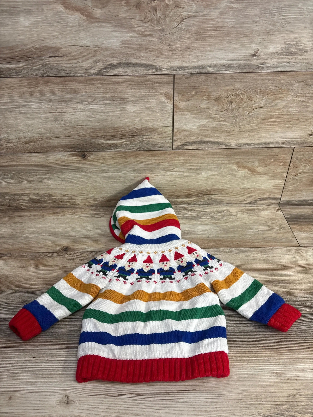 Colorful striped baby sweater with gnome pattern and hood, perfect for kids' winter wear