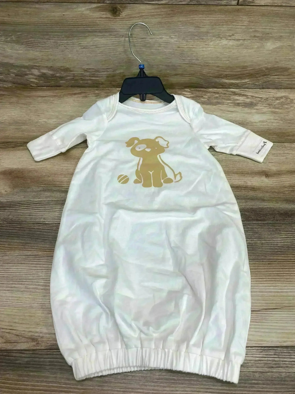 Front view of Bunnies By The Bay Skipit’s white baby gown size 0-3 months showing long sleeves and gathered hem on plain background