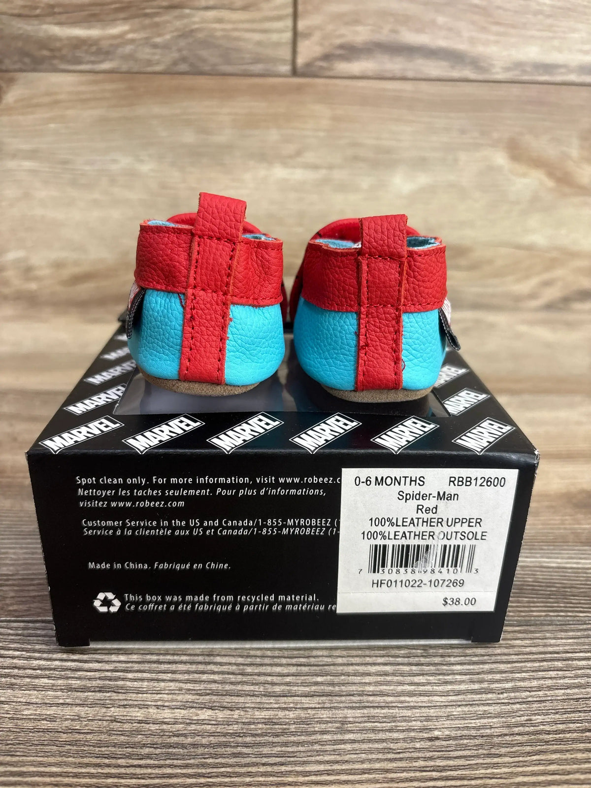 Red and blue Spider-Man leather baby shoes sized 0-6 months on Marvel-branded box