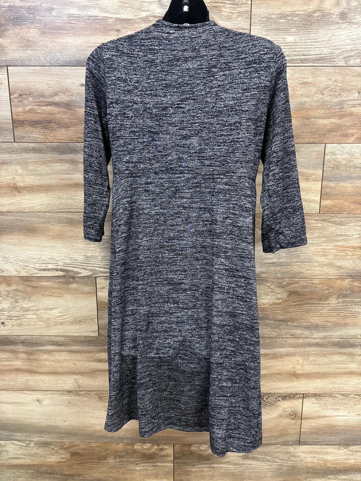 Back view of a gray marled knit maternity dress with three-quarter sleeves on a black hanger