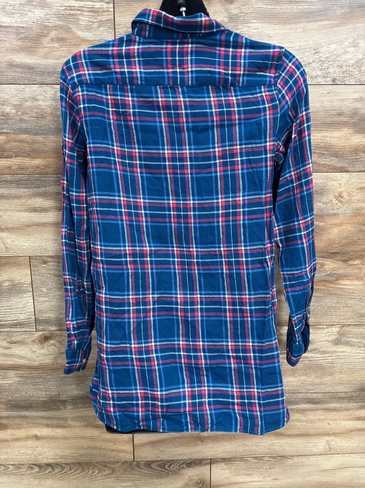 Kids blue and red plaid long sleeve shirt on wood background, back view