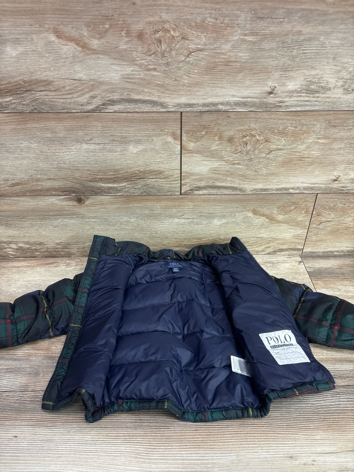 Interior view of a green plaid Me n Mommy To Be hooded puffer jacket for toddlers.