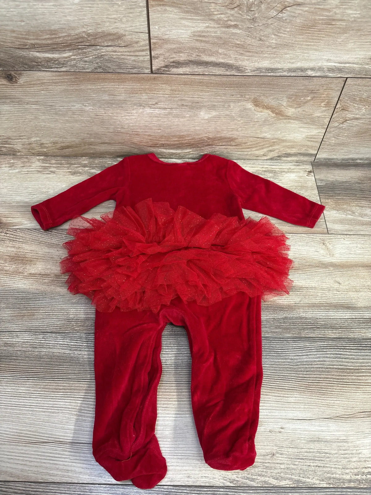 Red velvet baby onesie with tulle tutu skirt, perfect for festive occasions and baby photoshoots.