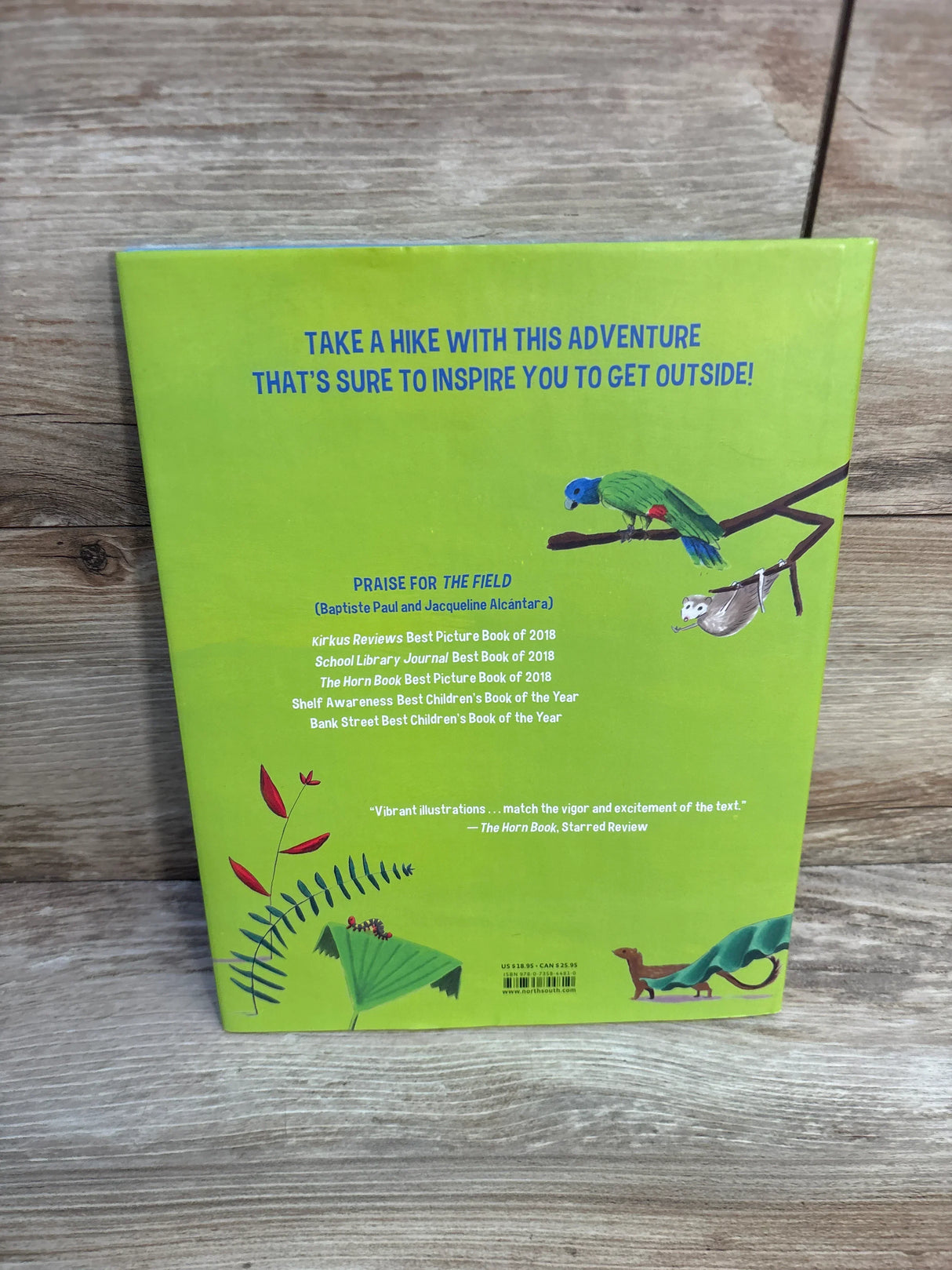 Back cover of a children's picture book with green jungle design, bird, sloth, and lizard illustrations.