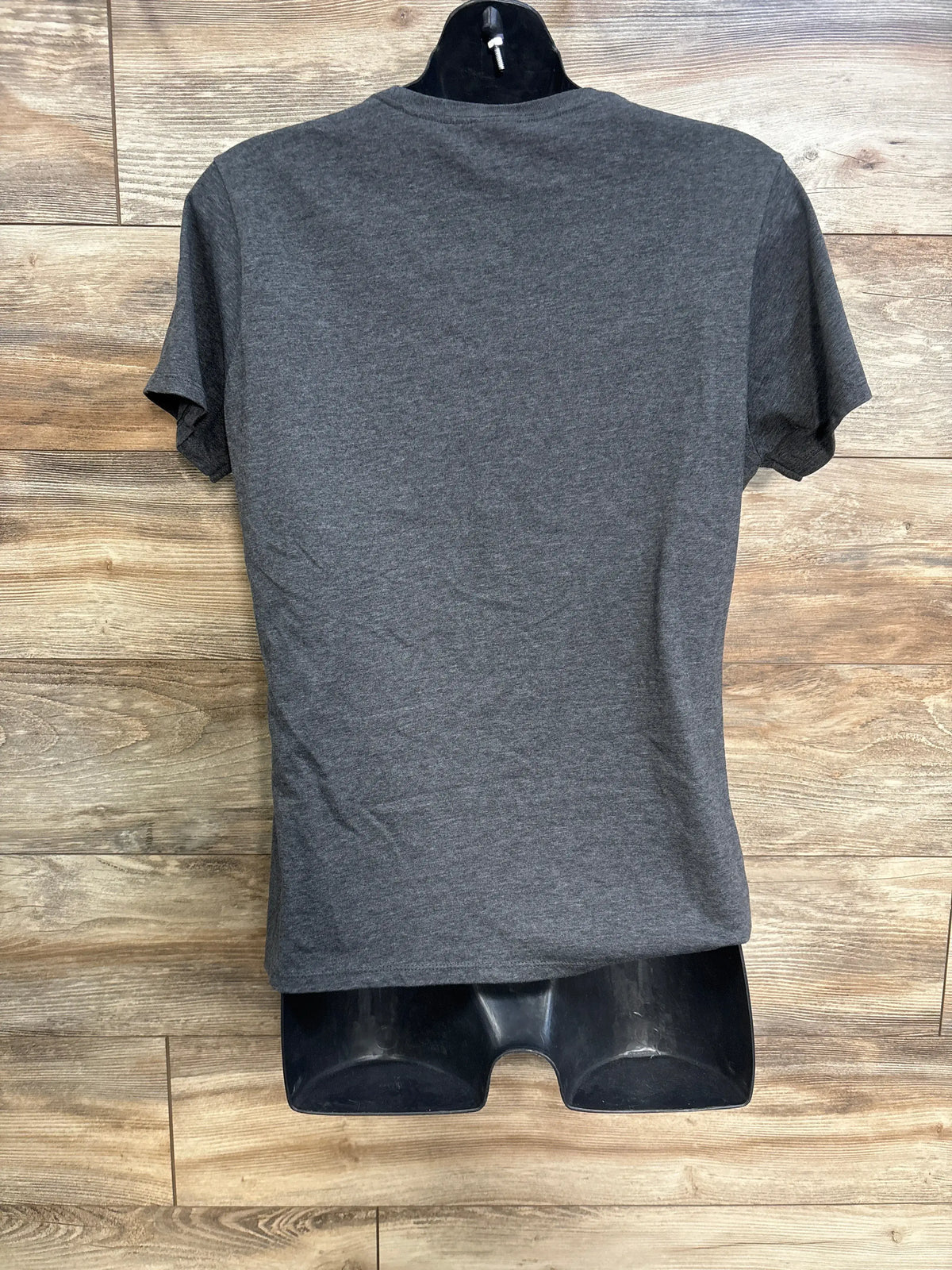 Back view of Port & Company maternity Bun in the Oven shirt in gray, showing a plain short-sleeve design on a black mannequin